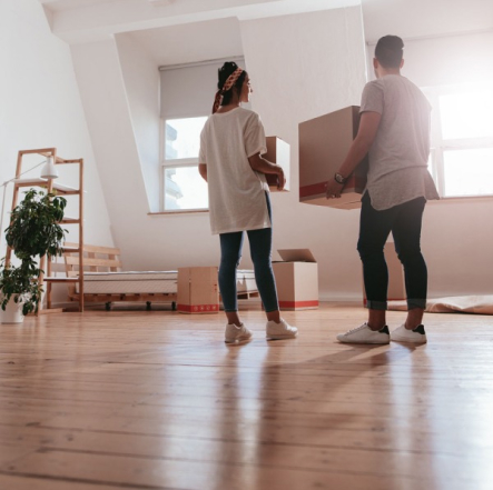 A couple moving boxes