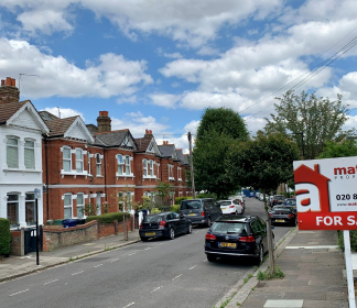 A house for sale with a Match a Property board outside it